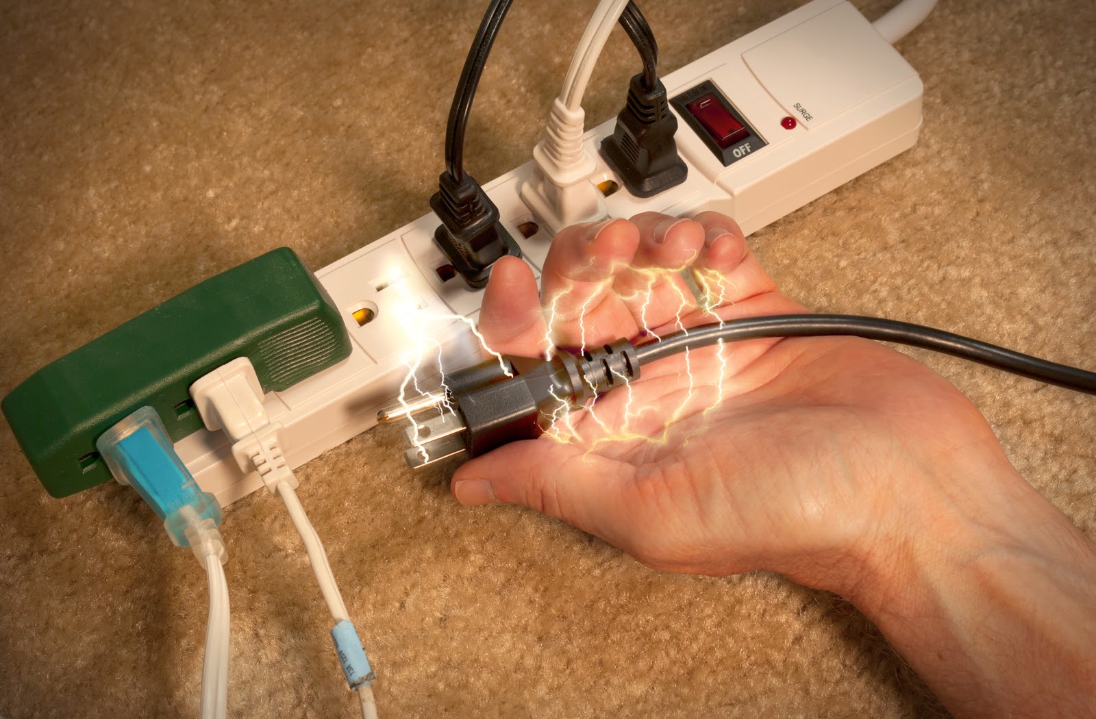 Man experiencing electrocution after removing electric plug at home