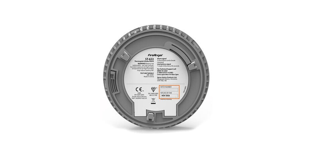 Underside of smoke alarm with expiration date highlighted.